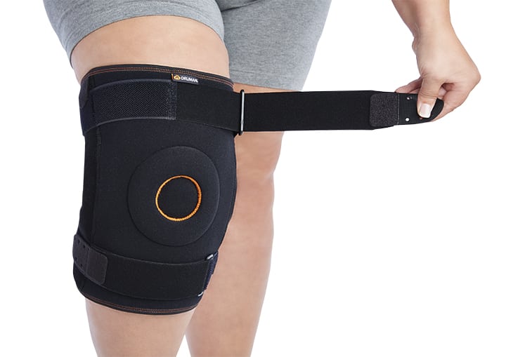 WRAPAROUND KNEE SUPPORT WITH BIAXIAL JOINTS AND METAL SUPPORTS
